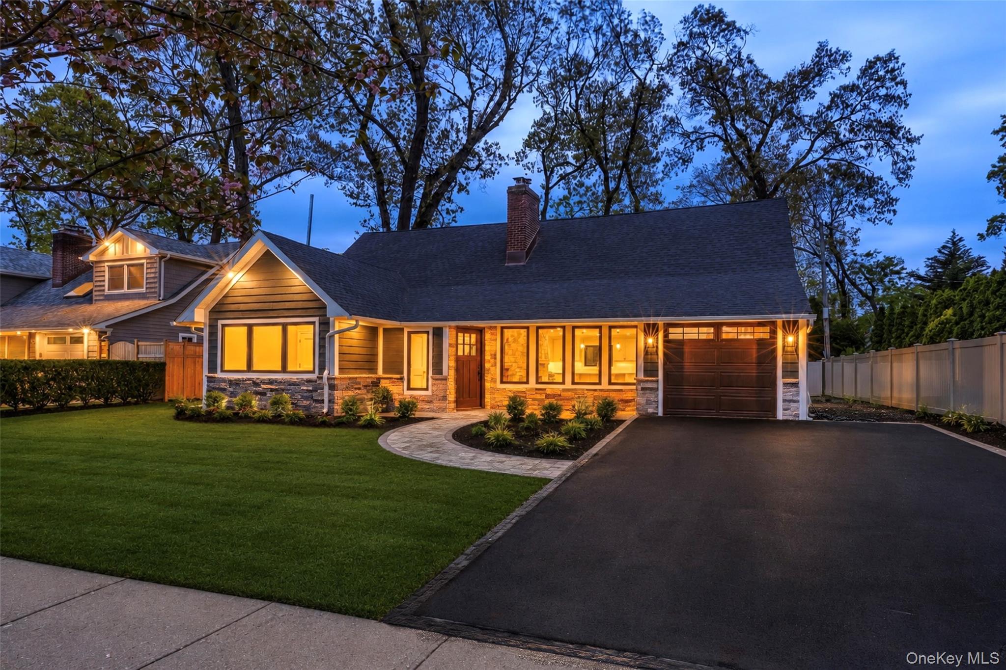 11 Ranch Place Merrick, NY 11566 - Photo 1 of 40 a front view of a house with a yard and outdoor seating