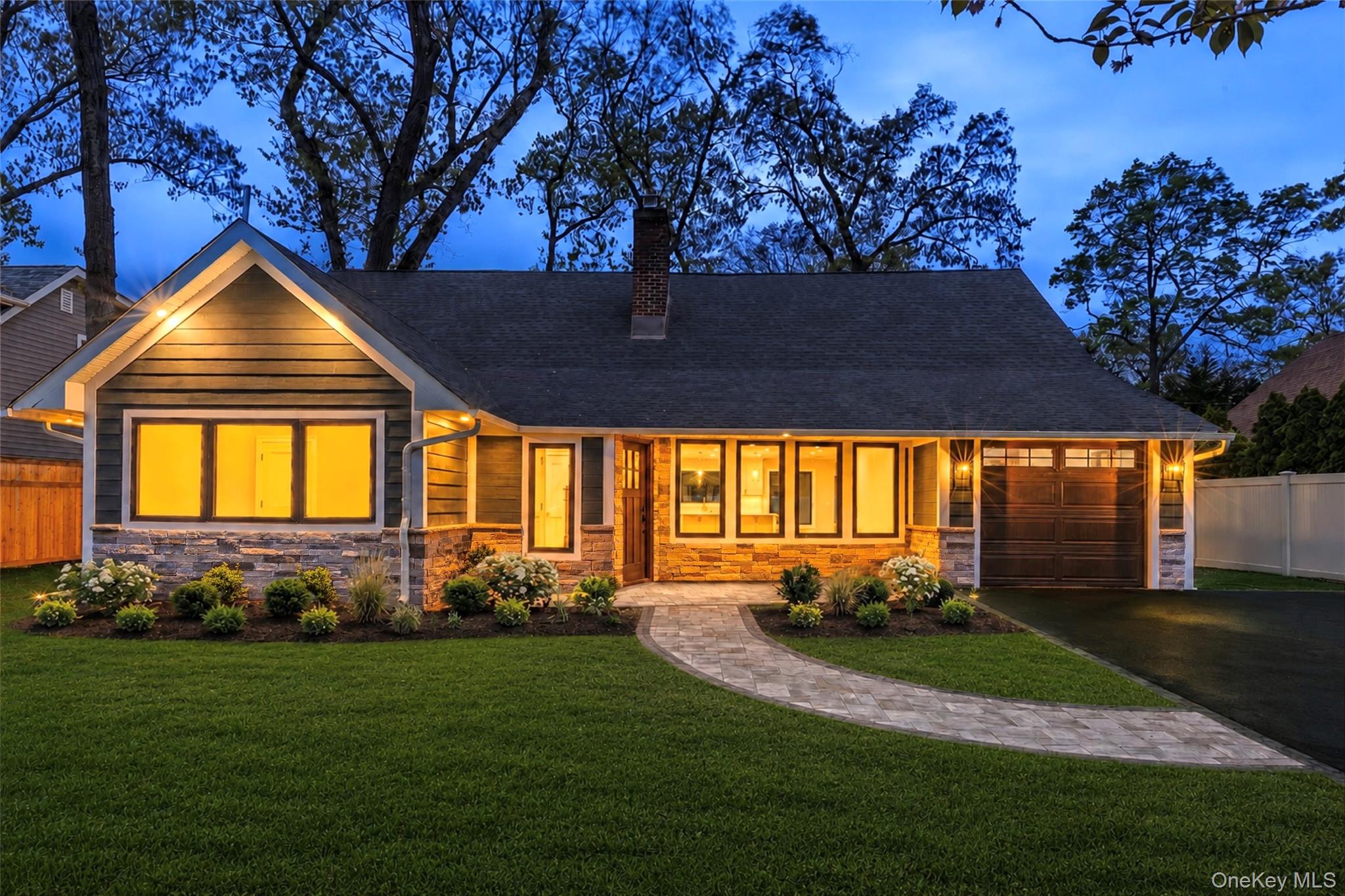 11 Ranch Place Merrick, NY 11566 - Photo 2 of 40 a front view of a house with garden