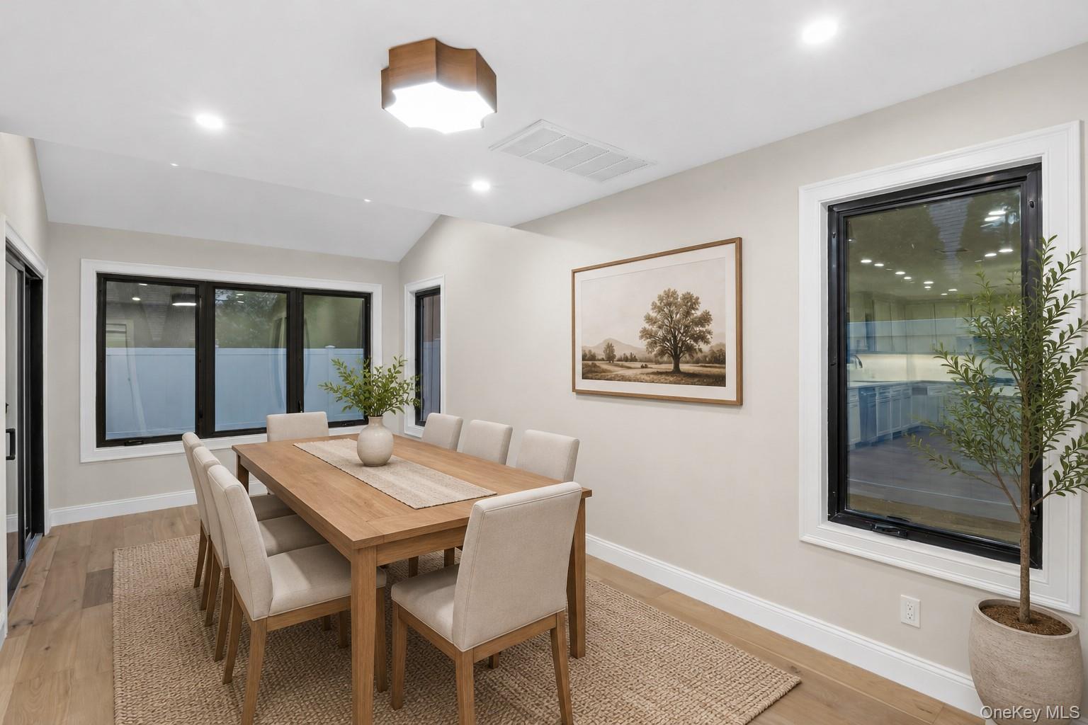 11 Ranch Place Merrick, NY 11566 - Photo 21 of 40 a view of a dining room with furniture window and wooden floor