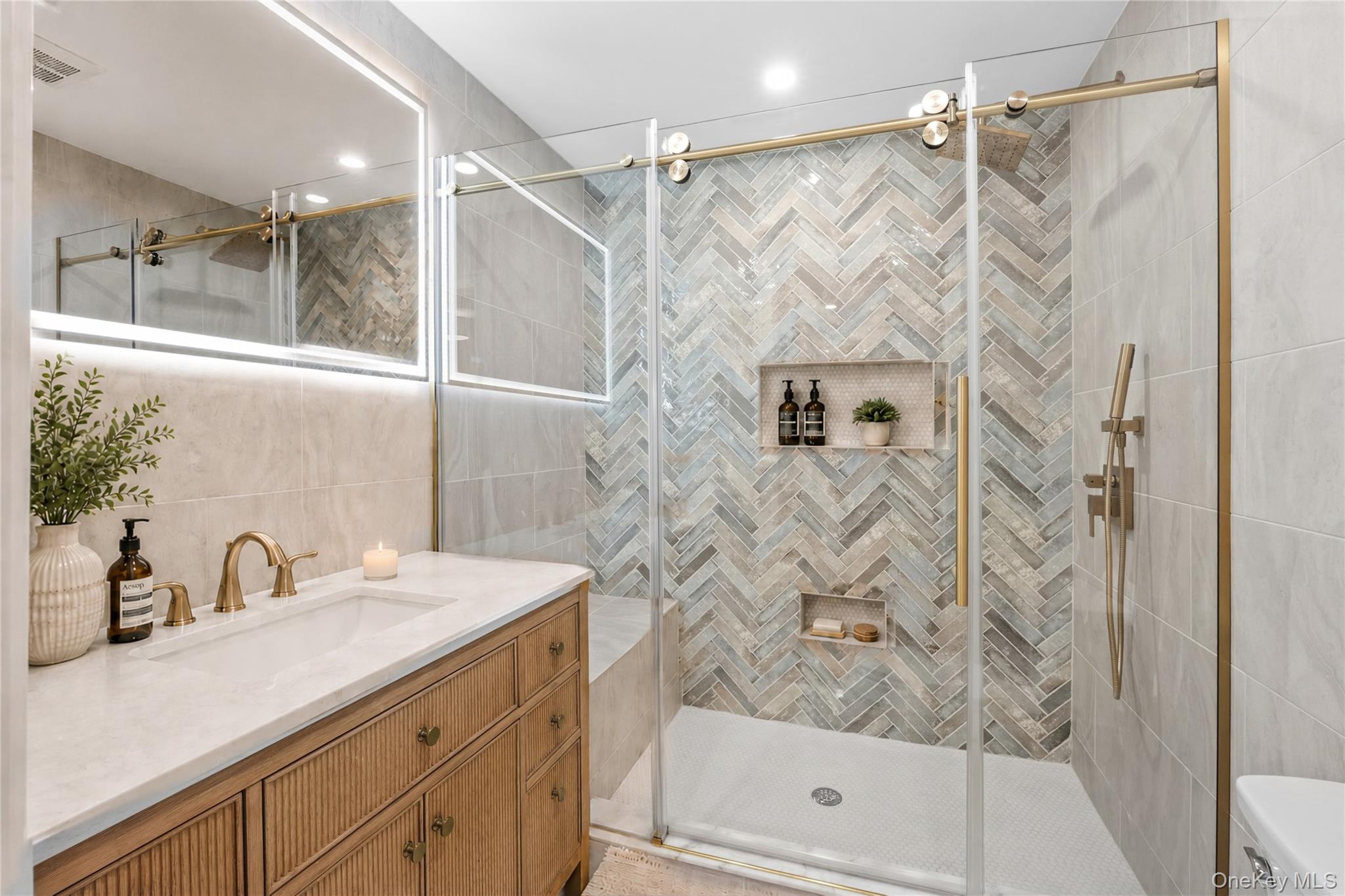 11 Ranch Place Merrick, NY 11566 - Photo 25 of 40 a bathroom with a shower and a sink