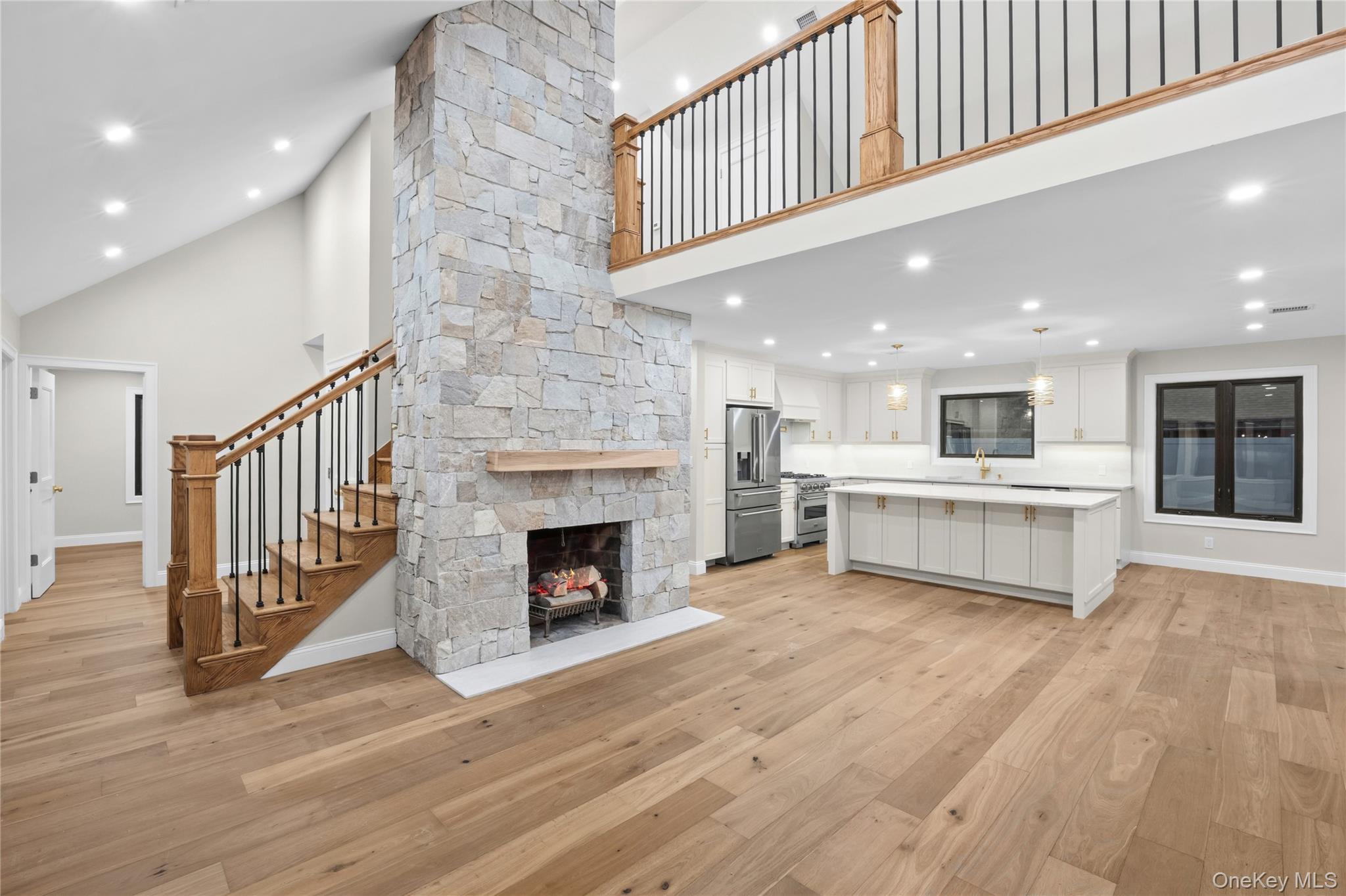 11 Ranch Place Merrick, NY 11566 - Photo 6 of 40 a view of a hallway with a fireplace and entryway