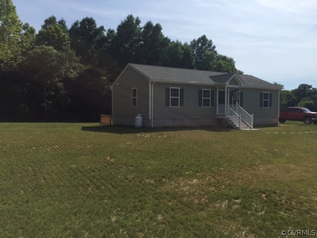 4959 Custis Millpond Road West Point, VA 23181 - Photo 1 of 1 a house view with a garden space
