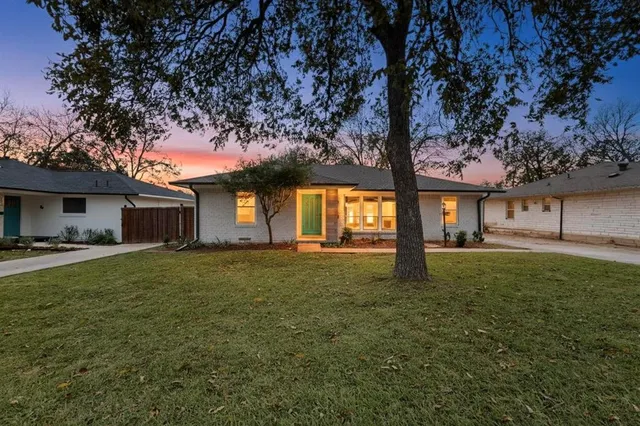 a view of a house with a back yard