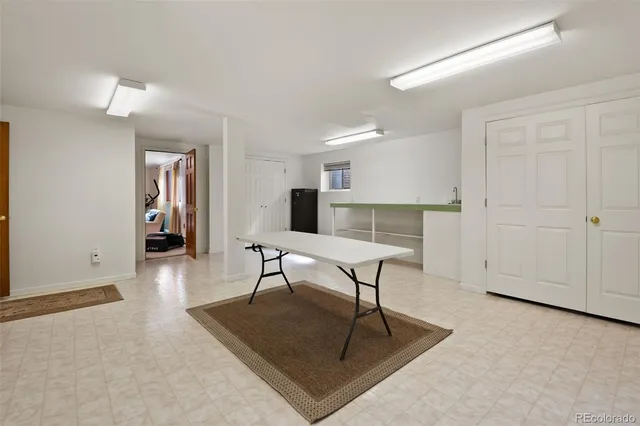 a bedroom with furniture and a book shelf