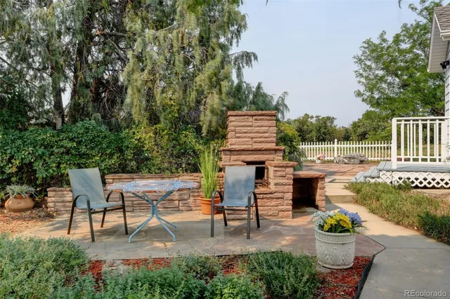 a view of a backyard with sitting area