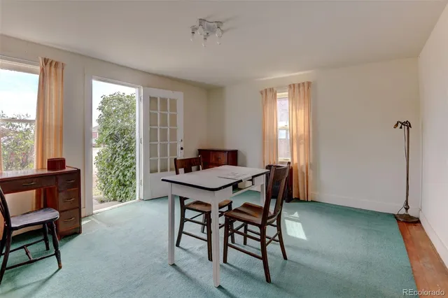 a view of a backyard with sitting area