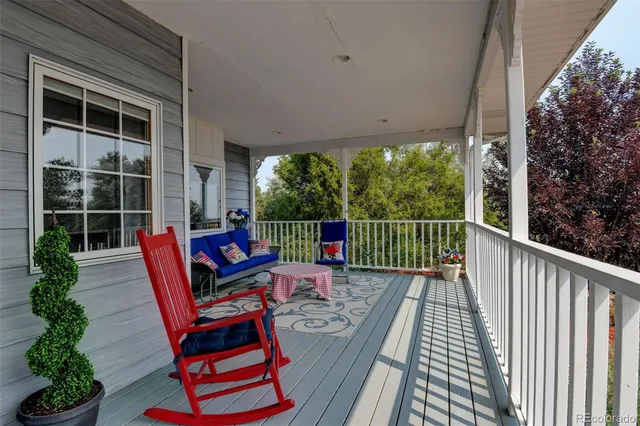 a view of a two chairs in the balcony