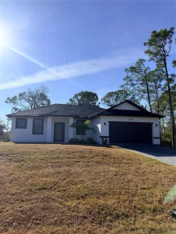 a front view of a house with yard