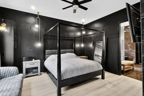 a bedroom with a bed and a walk in closet