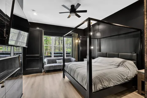 a bedroom with a bed and a walk in closet