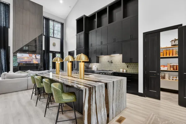 a kitchen with stainless steel appliances granite countertop a stove and a refrigerator
