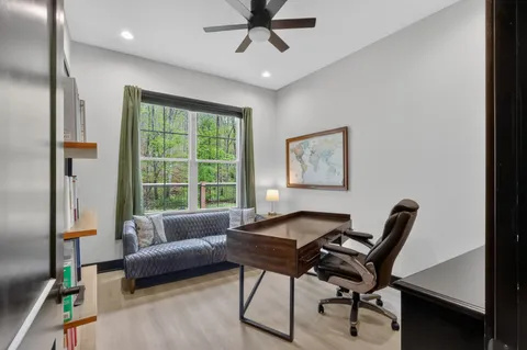 a workspace with furniture and wooden floor