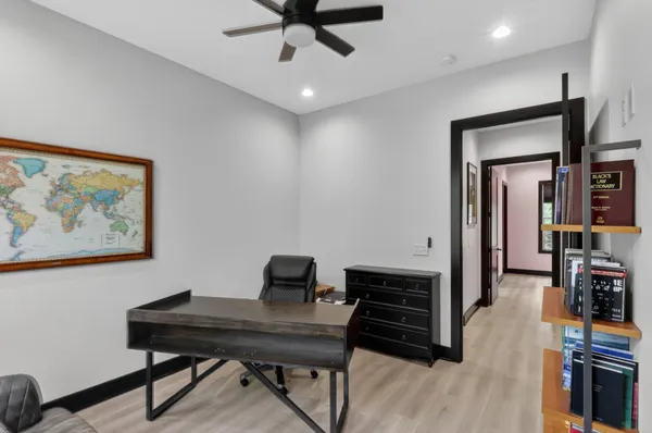 a room with pool table and window