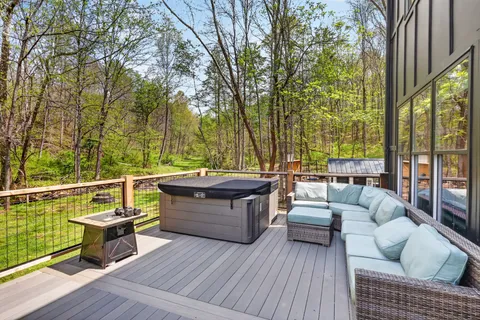 a view of balcony with couch and wooden floor