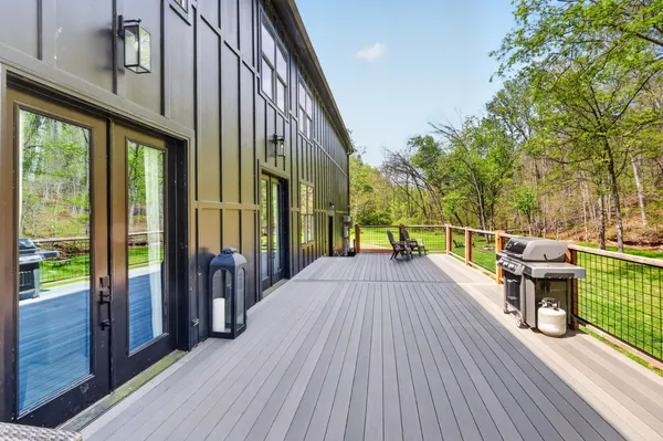a view of backyard with outdoor seating and green space