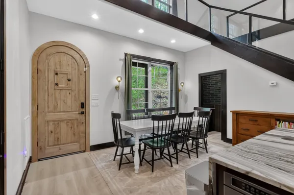 a view of a dining room with furniture window and wooden floor