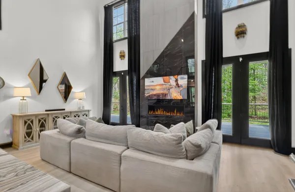 a living room with furniture and a flat screen tv
