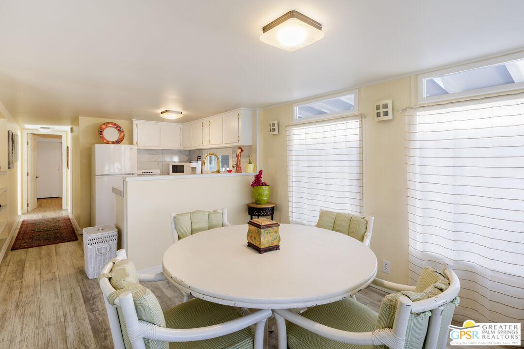 157 Caravan Street Palm Springs, CA 92264 - Photo 11 of 38 a dining room with furniture and window