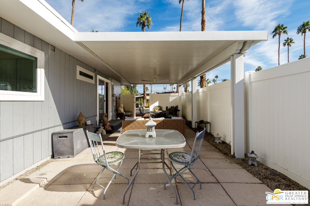 157 Caravan Street Palm Springs, CA 92264 - Photo 26 of 38 a living room with a table and chairs