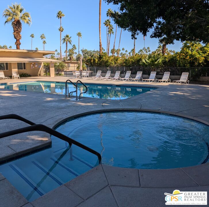 157 Caravan Street Palm Springs, CA 92264 - Photo 31 of 38 a view of a swimming pool with outdoor seating