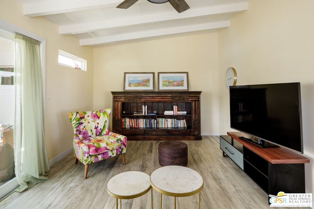 157 Caravan Street Palm Springs, CA 92264 - Photo 6 of 38 a living room with furniture and a flat screen tv