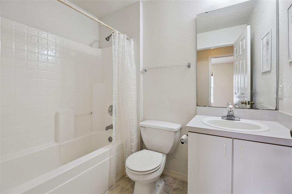 124 Diamond Ridge Boulevard Auburndale, FL 33823 - Photo 16 of 20 a bathroom with a sink toilet and shower
