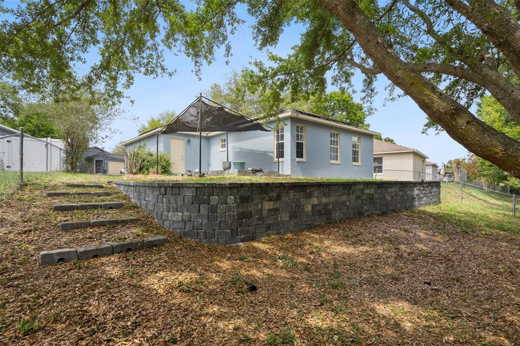 124 Diamond Ridge Boulevard Auburndale, FL 33823 - Photo 19 of 20 a view of a house with a yard