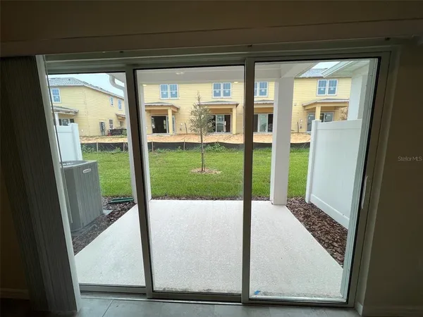 a view of an entrance to house with yard