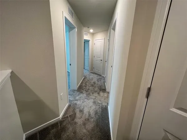 a view of a hallway with closet area