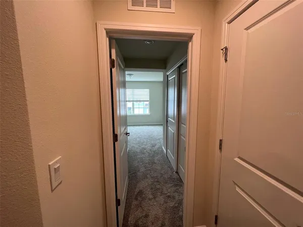 a view of hallway with stairs