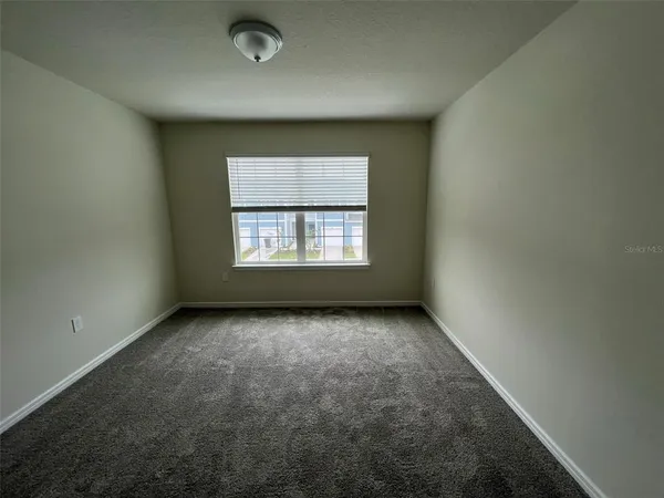 an empty room with window