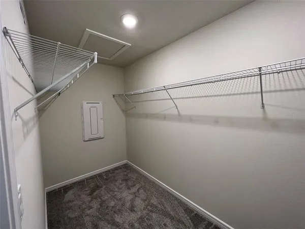 a room with a sink vanity and mirror