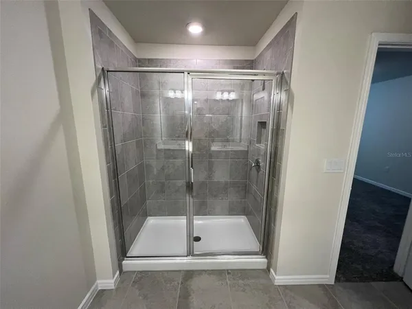 a white toilet sitting next to a small sink