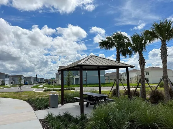 a view of a street with cars parked