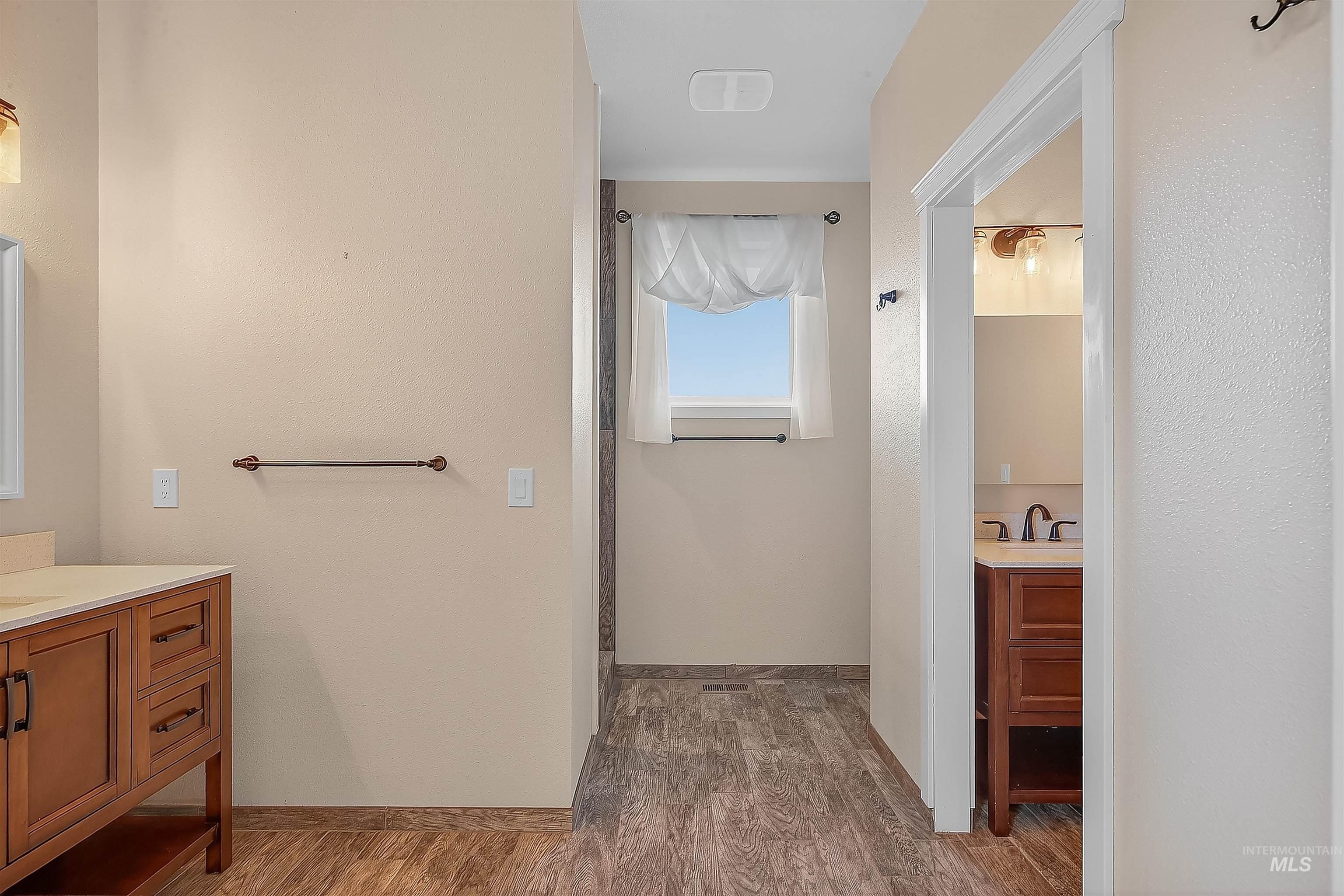 2233 Burrell Avenue Lewiston, ID 83501 - Photo 18 of 48 Bathroom featuring vanity and dark wood-style flooring