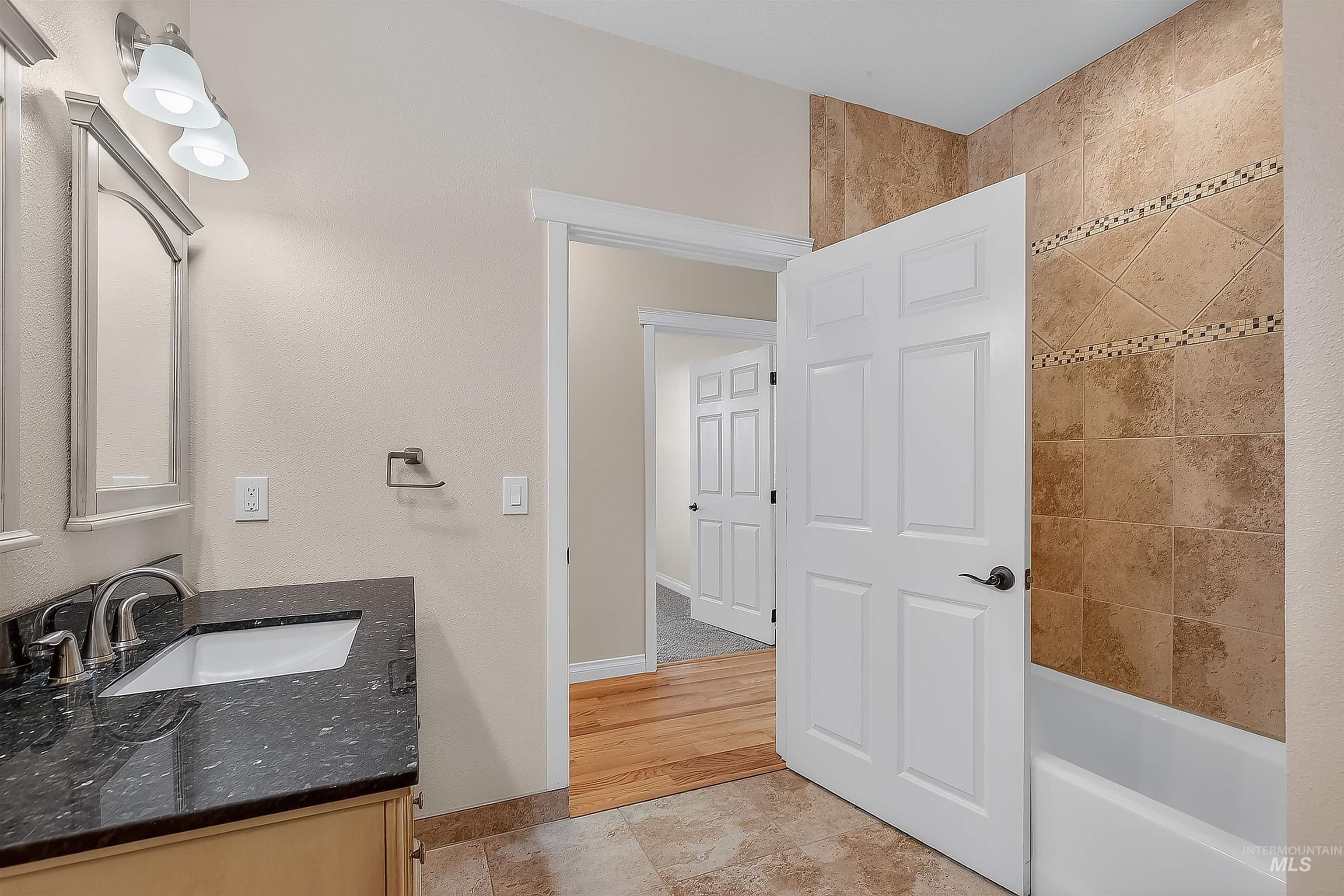 2233 Burrell Avenue Lewiston, ID 83501 - Photo 26 of 48 Full bathroom with vanity, shower / bath combination, and light tile patterned floors