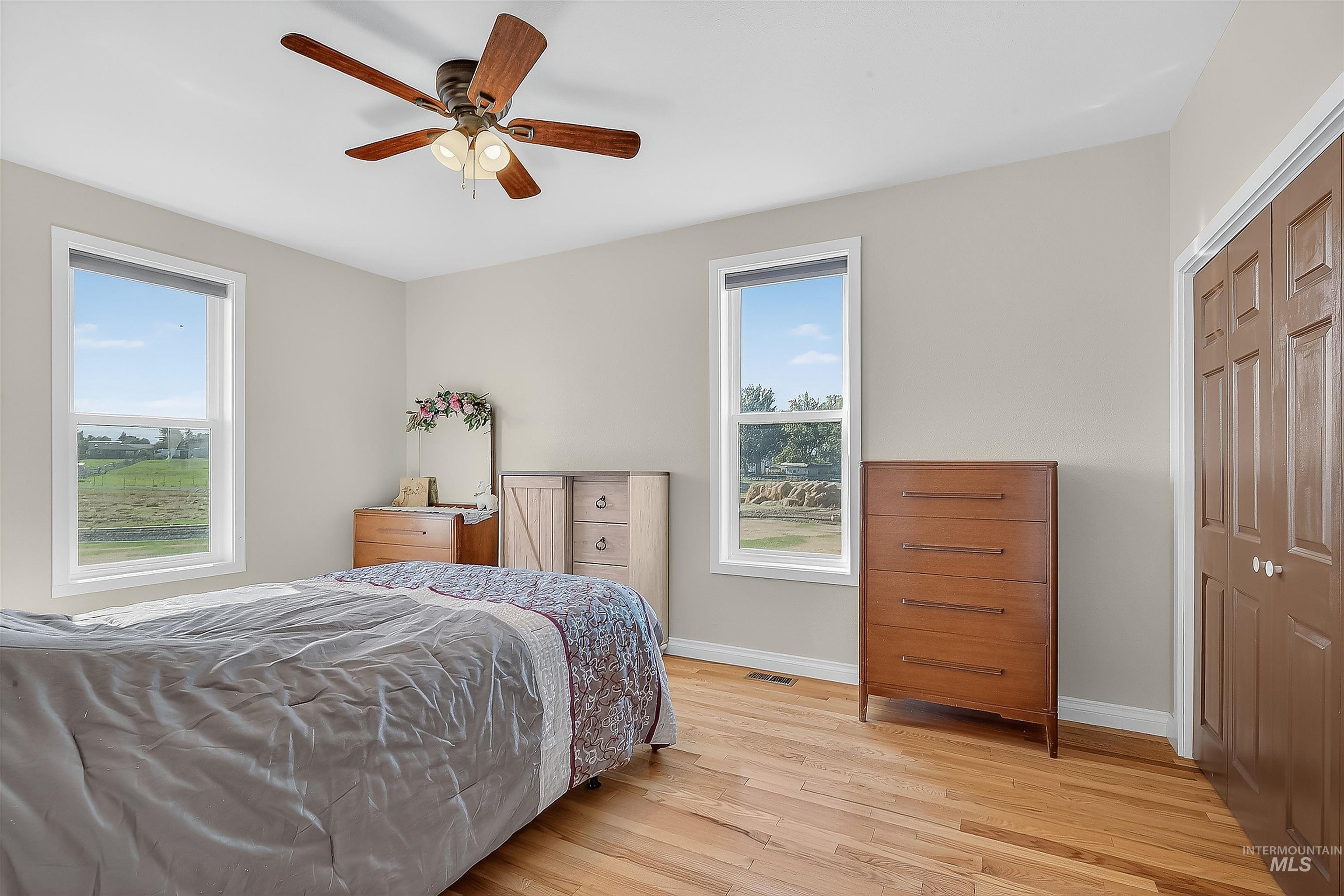 2233 Burrell Avenue Lewiston, ID 83501 - Photo 29 of 48 Bedroom featuring light wood-style floors, ceiling fan, and a closet