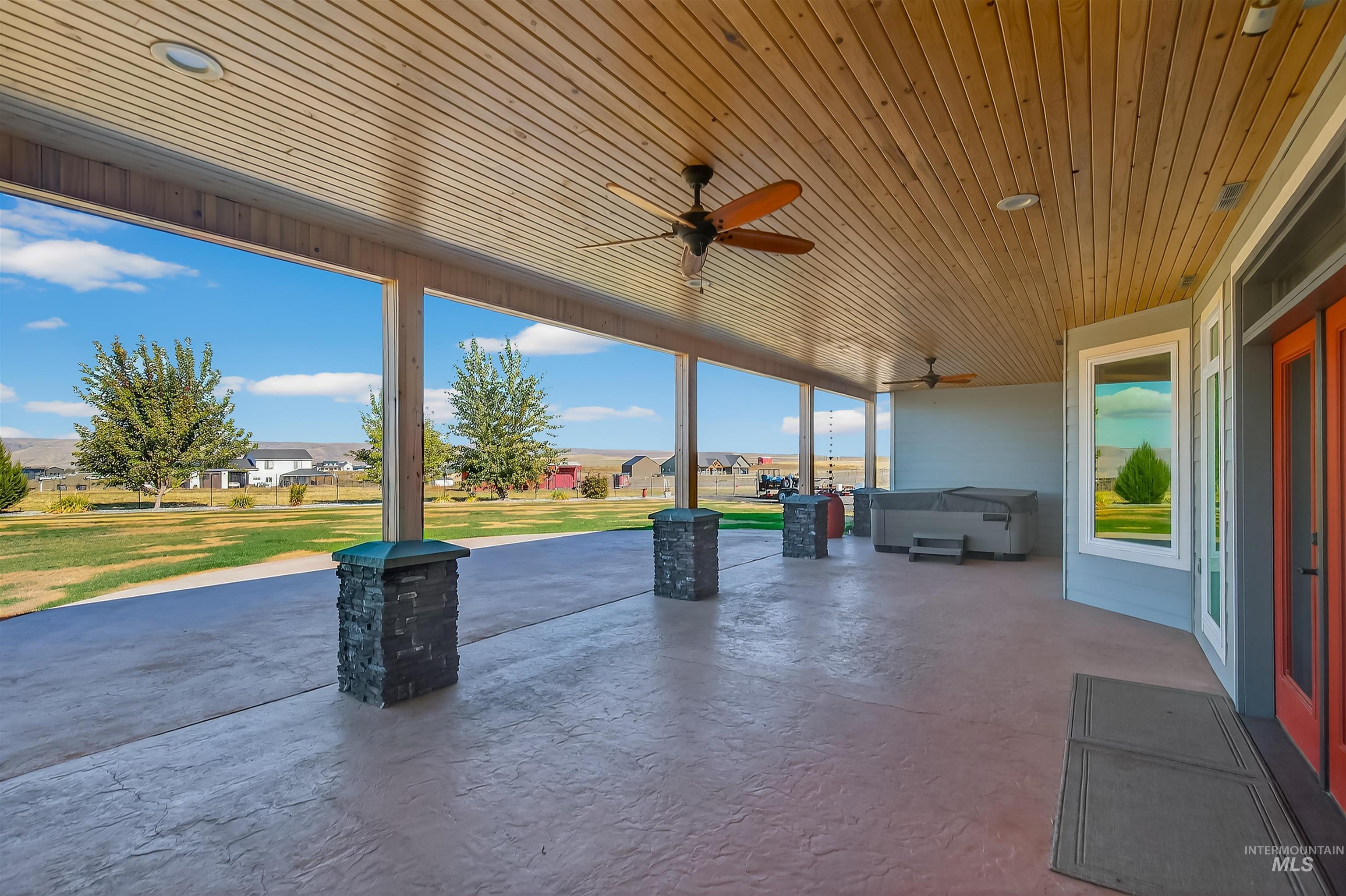 2233 Burrell Avenue Lewiston, ID 83501 - Photo 34 of 48 View of patio / terrace with ceiling fan and a hot tub