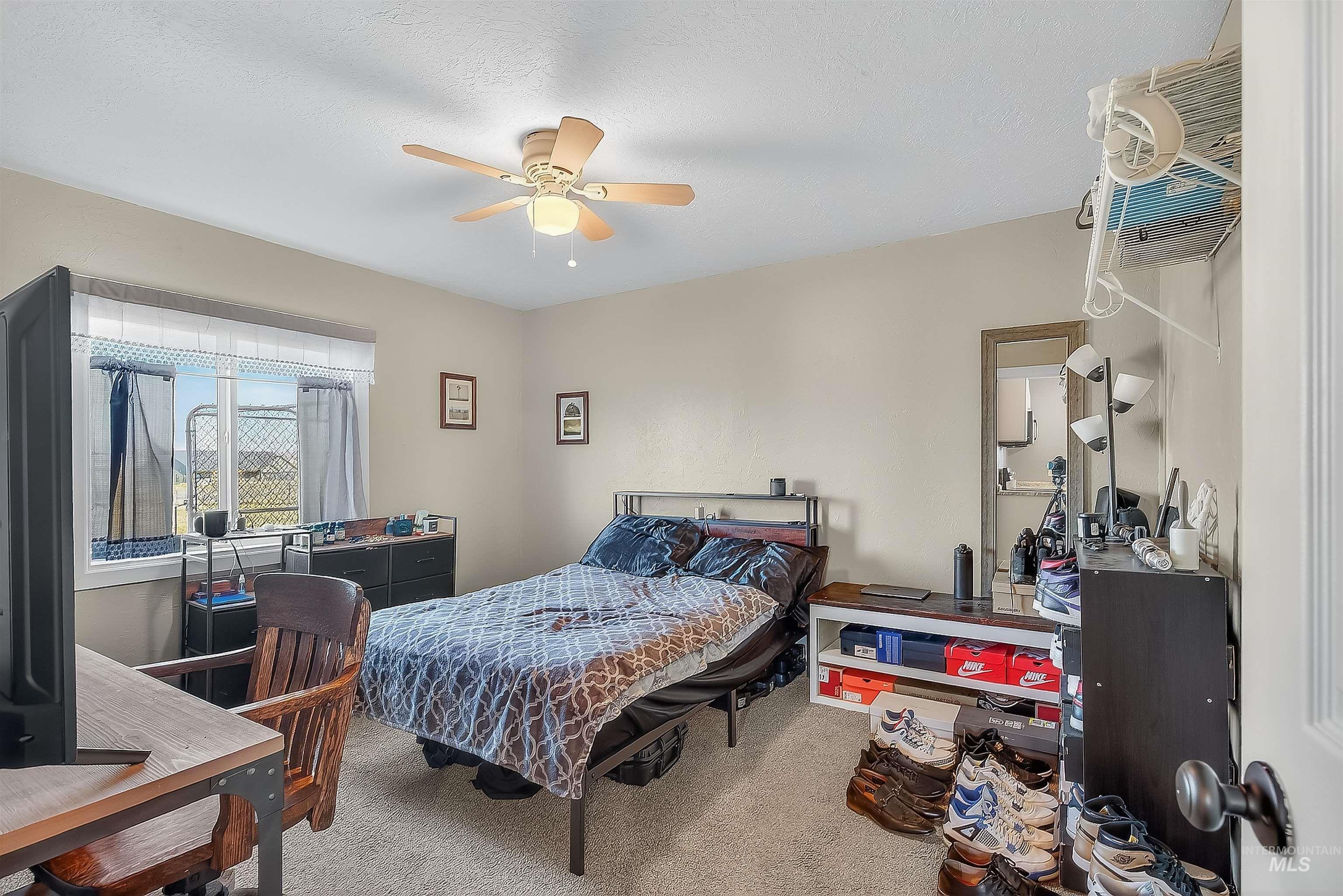 2233 Burrell Avenue Lewiston, ID 83501 - Photo 39 of 48 Carpeted bedroom featuring a ceiling fan