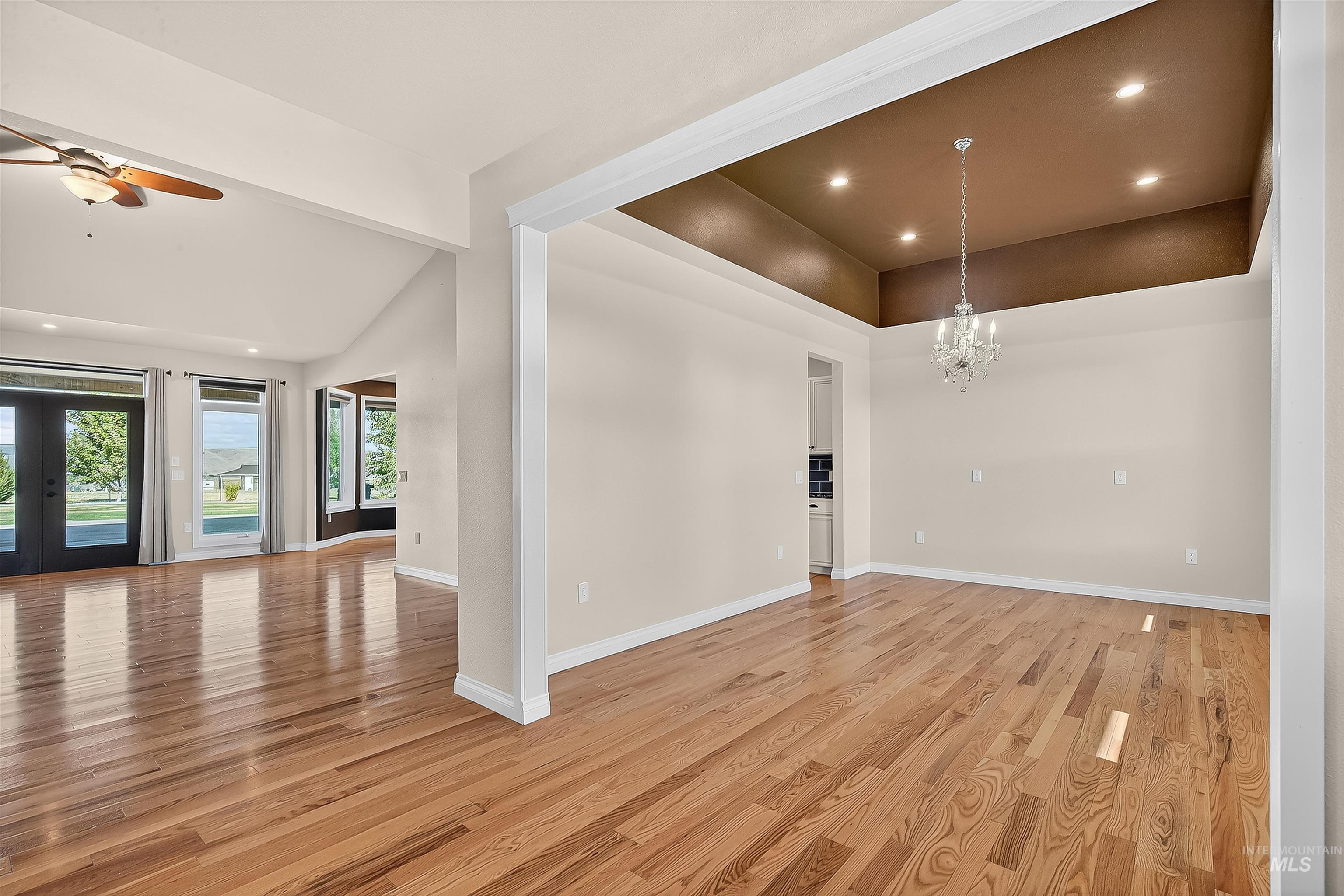 2233 Burrell Avenue Lewiston, ID 83501 - Photo 6 of 48 Empty room with recessed lighting, light wood-type flooring, a chandelier, a ceiling fan, and french doors