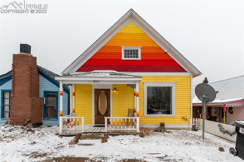 a view of a house with outdoor seating