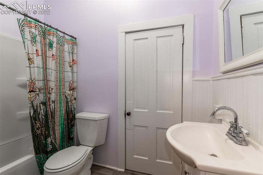 210 South 2nd Street Victor, CO 80860 - Photo 14 of 30 a bathroom with a sink a toilet and shower
