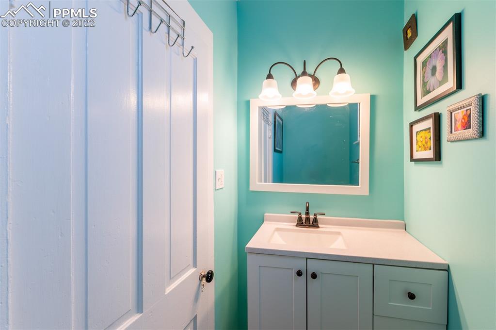 210 South 2nd Street Victor, CO 80860 - Photo 25 of 30 a bathroom with a sink and a mirror