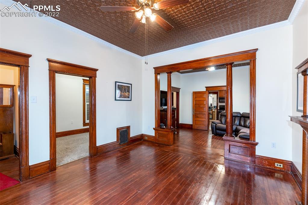210 South 2nd Street Victor, CO 80860 - Photo 5 of 30 a hallway with wooden floor and closet
