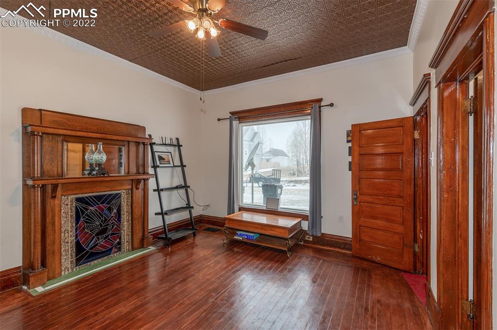 210 South 2nd Street Victor, CO 80860 - Photo 7 of 30 a living room with furniture and a fireplace
