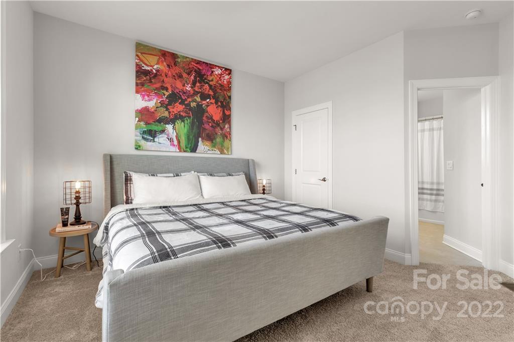 6028 Candlestick Lane Lancaster, SC 29720 - Photo 15 of 34 a bedroom with a bed and a painting on the wall