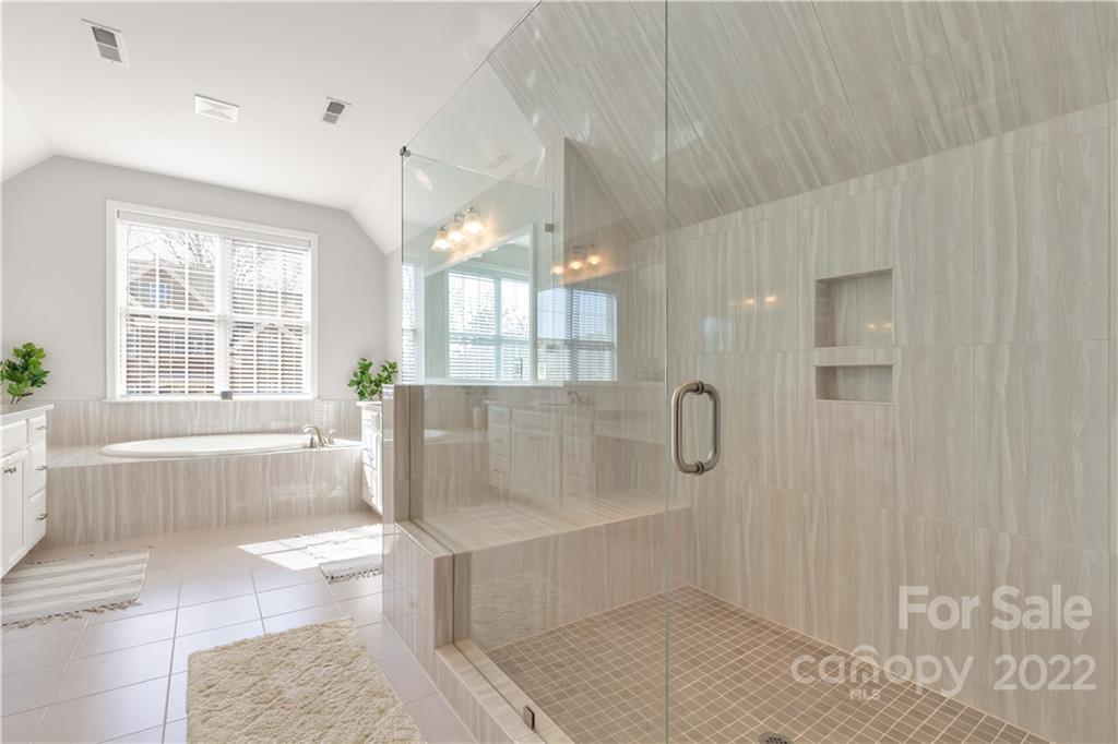 6028 Candlestick Lane Lancaster, SC 29720 - Photo 21 of 34 a bathroom with bathtub shower and window