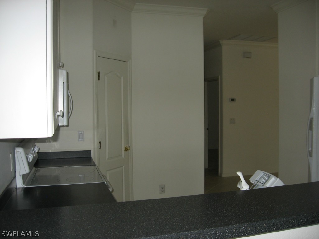 4676 Fairloop Run Lehigh Acres, FL 33973 - Photo 11 of 21 a view of entryway with wooden floor