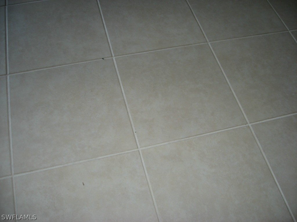 4676 Fairloop Run Lehigh Acres, FL 33973 - Photo 15 of 21 a bathroom with a shower