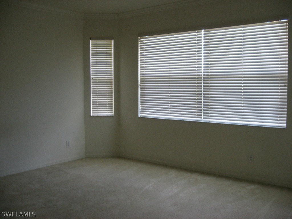 4676 Fairloop Run Lehigh Acres, FL 33973 - Photo 19 of 21 an empty room with a window